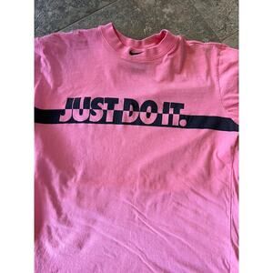 Nike pink high neck, short sleeve T-shirt with graphics.  Women's size M